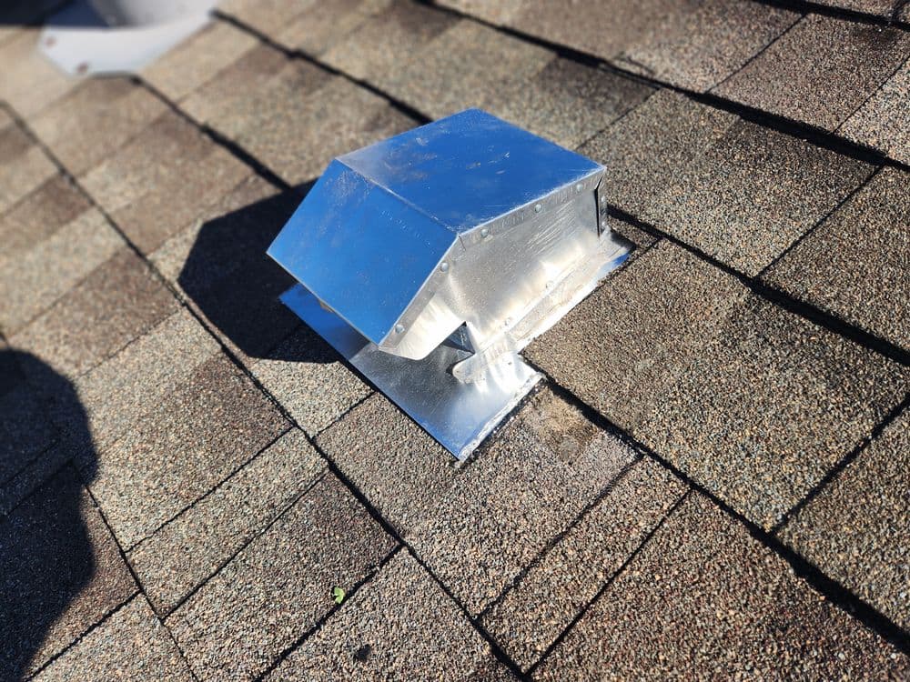 Wide view of a home showcasing a complete roofing system and gutter installation accomplished by Frontier Roofing Co.